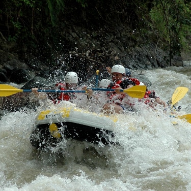 river rafting through rapids