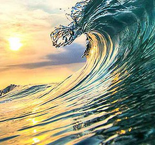 surf wave on Playa Jaco in Costa Rica
