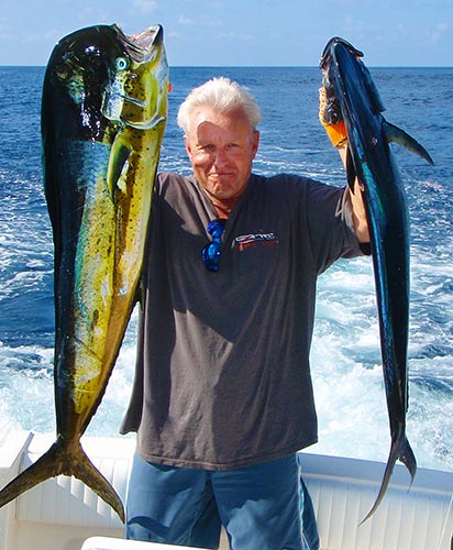 man with fish on costa rica charter boat