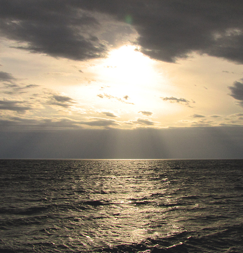 sun over ocean in costa rica