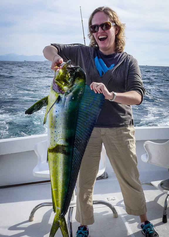woman with a dorado on fishing charter in Costa Rica