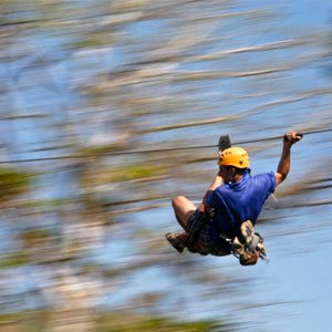 man on a zipline on a Los Suenos Canopy Tour