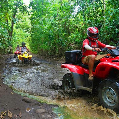 ATV riders taking a rainforest tour in Costa Rica